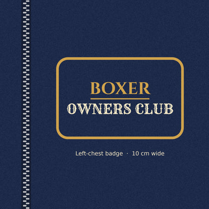 Close-up of the gold-outlined Boxer Owners Club badge on the left chest of the men's zip hoodie