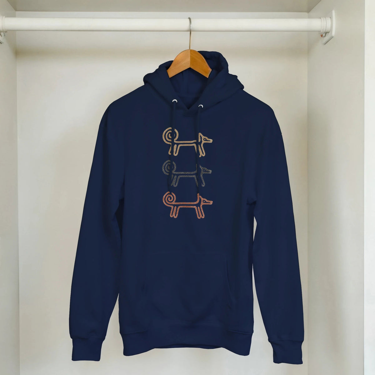 Navy Dog Totem men's hoodie hanging on a clothes rail