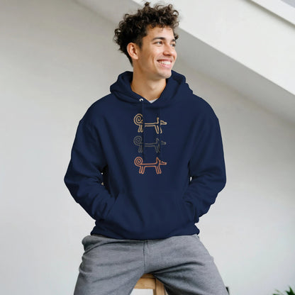 Smiling man seated in the navy Dog Totem men's hoodie