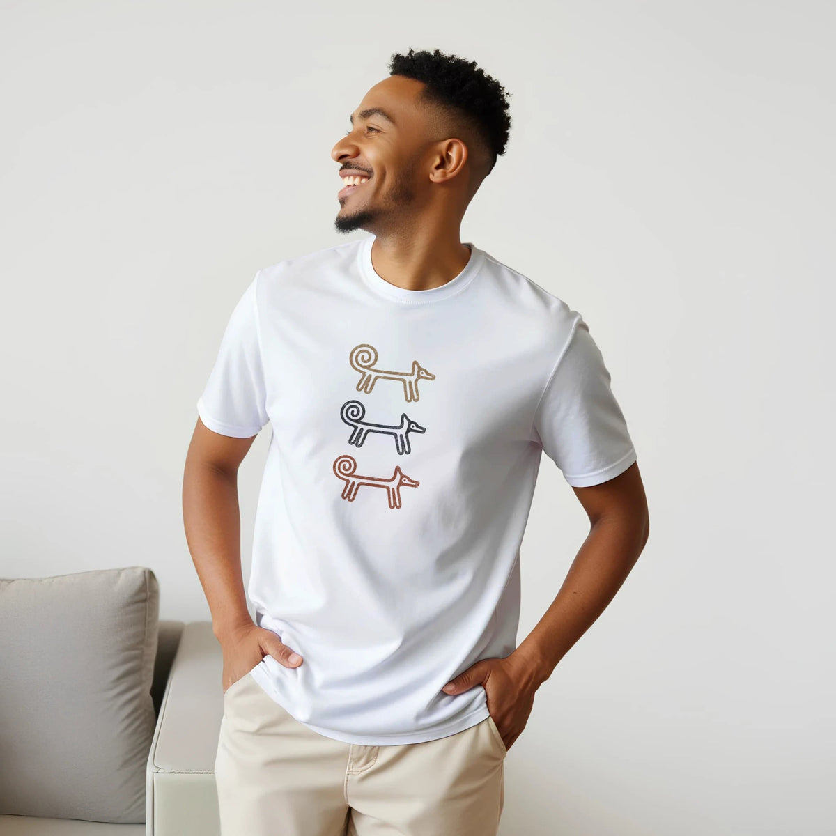 Smiling man in the white Dog Totem men's T-shirt